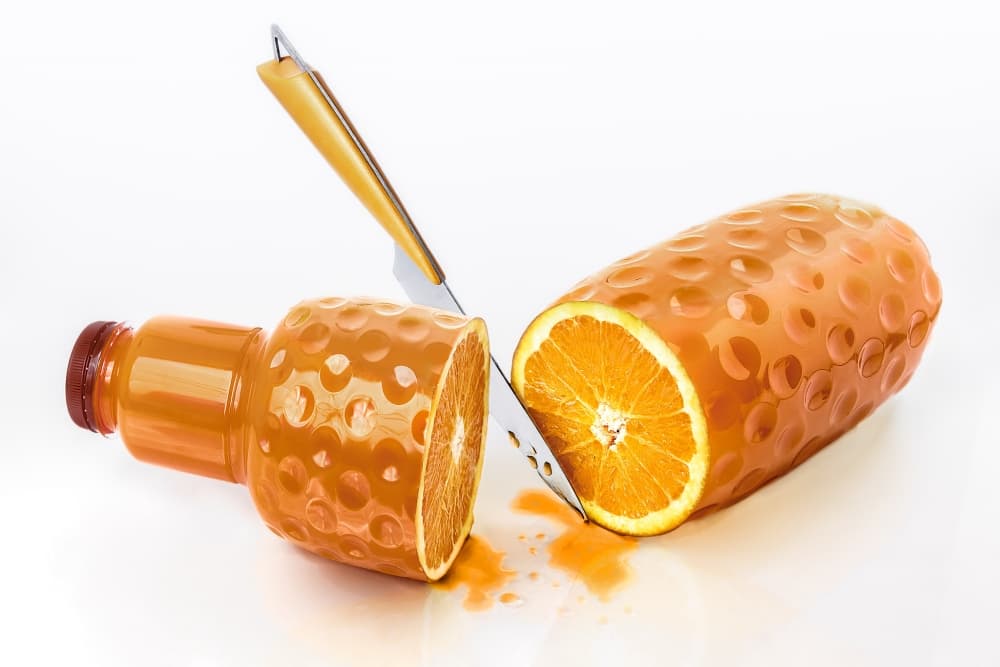 Freshly Sliced Orange Juice by Jesús M. García — canvas wall art