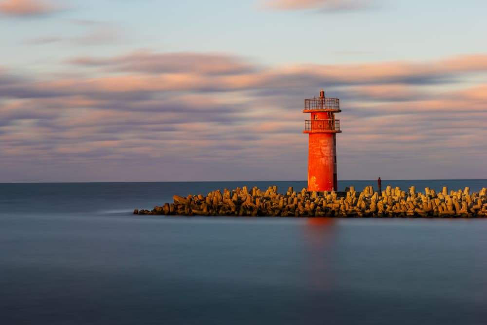 Red Lighthouse Serenity by Alaa Nour — canvas wall art