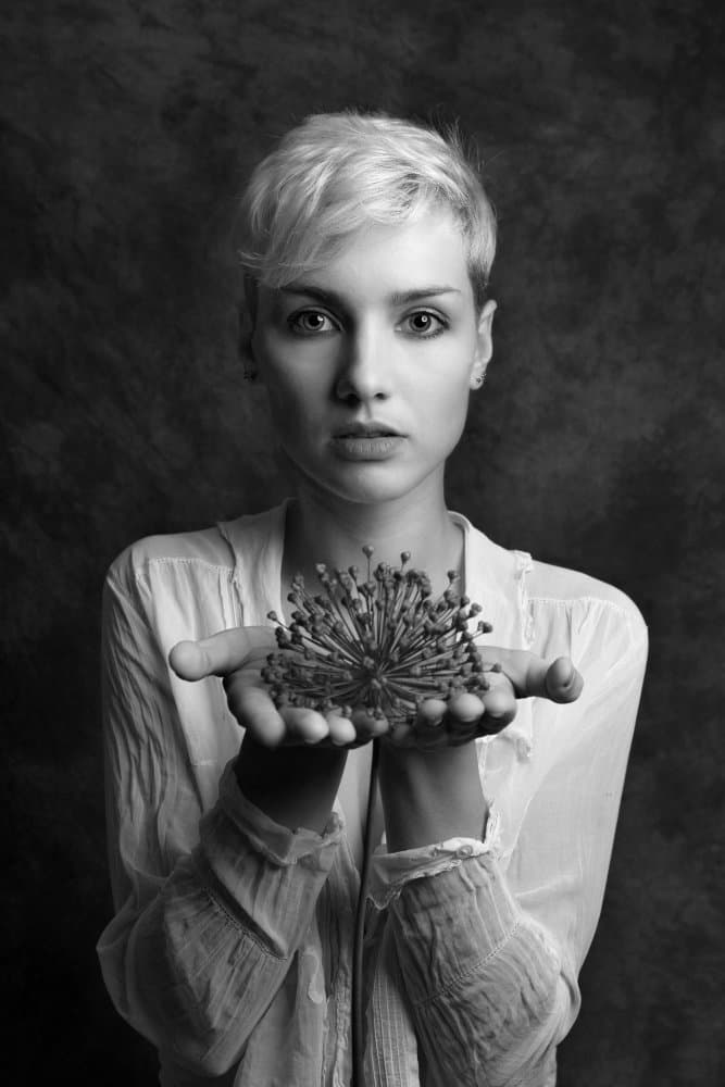 Woman Holding Dried Flower by Ruth Franke — canvas wall art