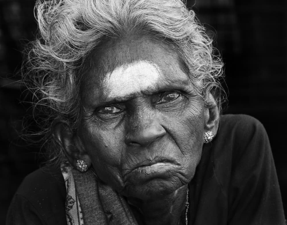 Elderly Woman's Gaze by Lou Urlings — canvas wall art