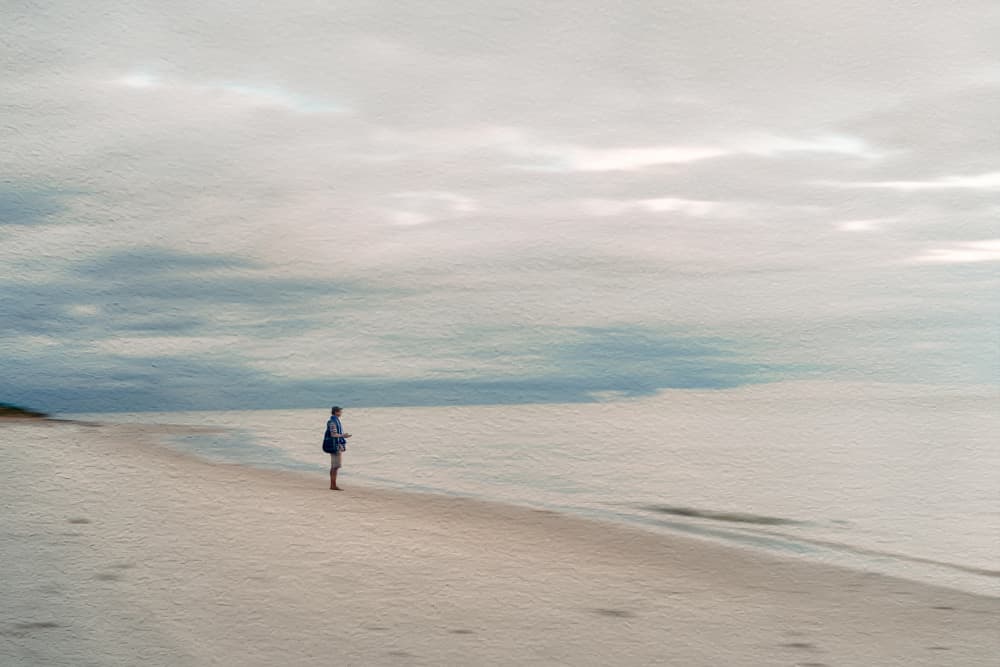 Lone Figure on Quiet Beach by Cindy Liu — canvas wall art