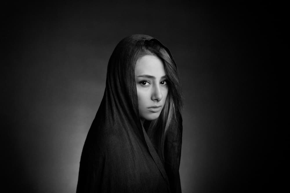 Pensive Hooded Woman by Mehdi Mokhtari — canvas wall art