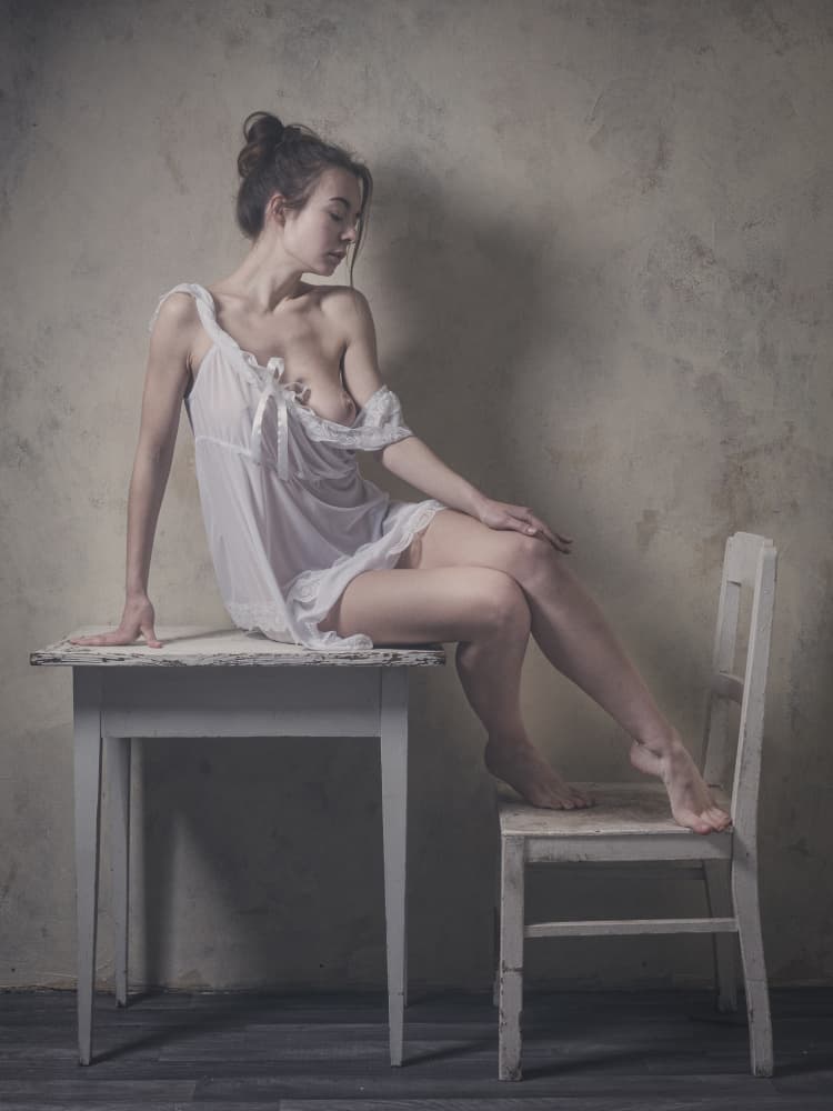 Pensive Woman In White by Ruth Franke — canvas wall art