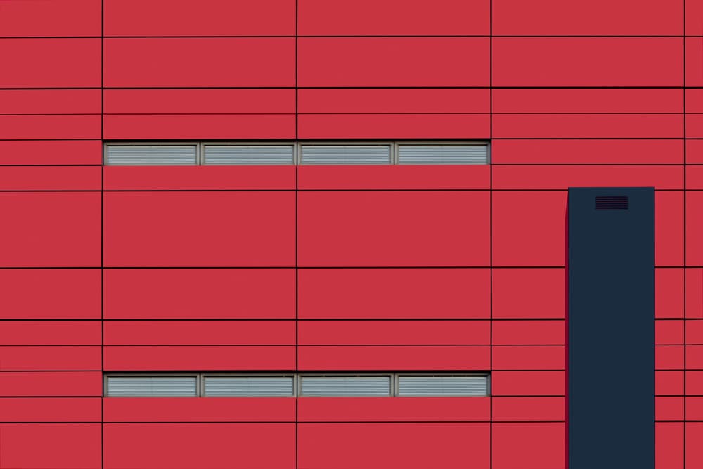 Red Facade Blue Structure by Jan Niezen — canvas wall art