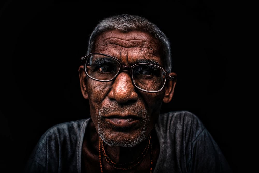 Older Man with Glasses by Kuntal Biswas — canvas wall art