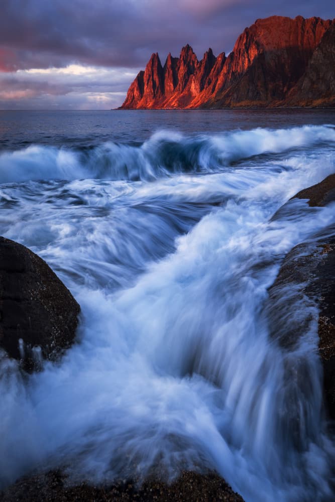 Red Peaks Flowing Ocean by Daniel Gastager — canvas wall art