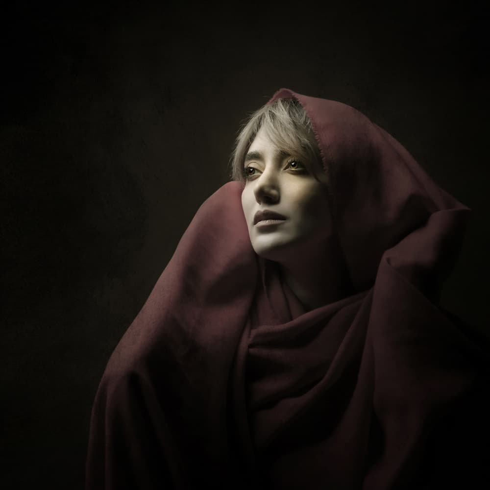 Crimson Hooded Woman by Moein Hasheminasab — canvas wall art