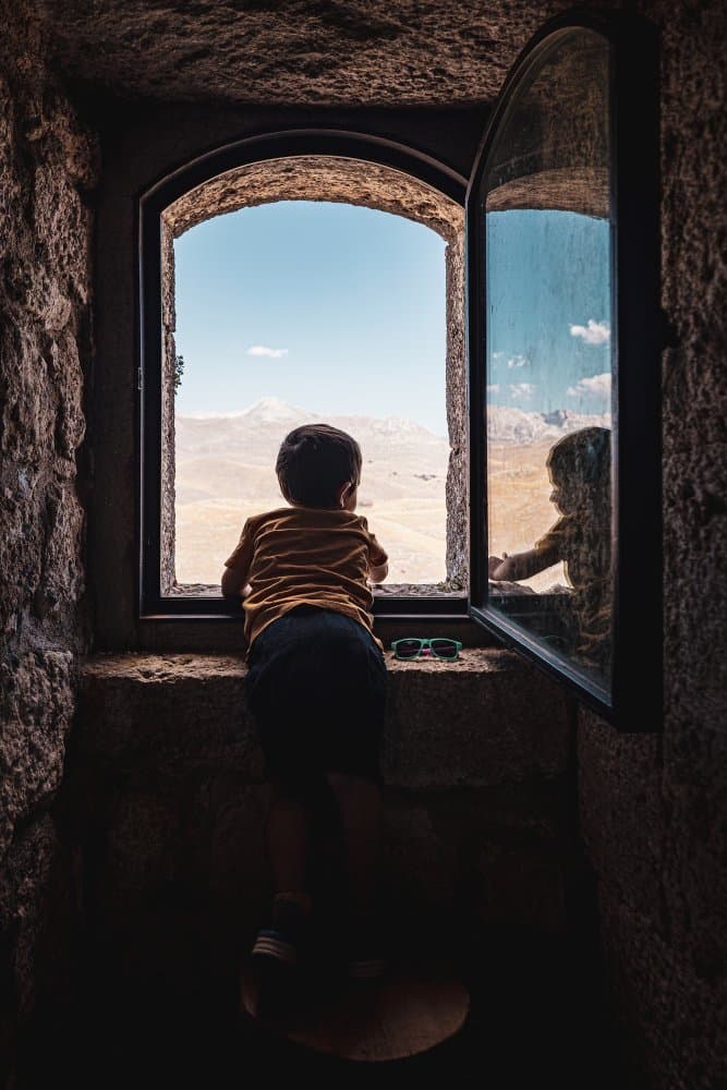 Child Views Vast Landscape by Marco Tagliarino — canvas wall art