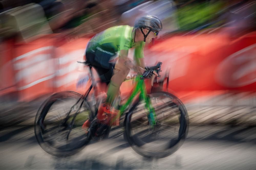 Speeding Green Cyclist by Milan Malovrh — canvas wall art