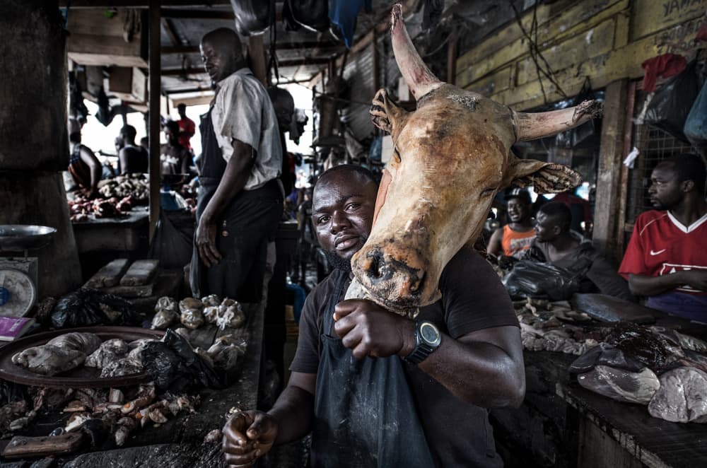 Butcher Carrying Cow Head by Joxe Inazio Kuesta Garmendia — canvas wall art