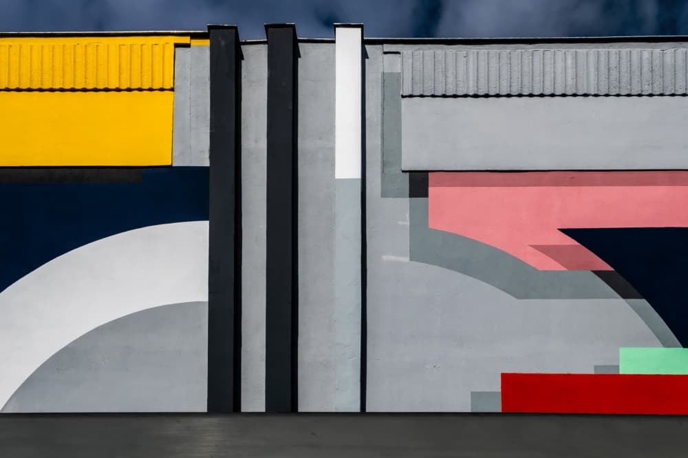 Colorful Geometric Building by Lus Joosten — canvas wall art