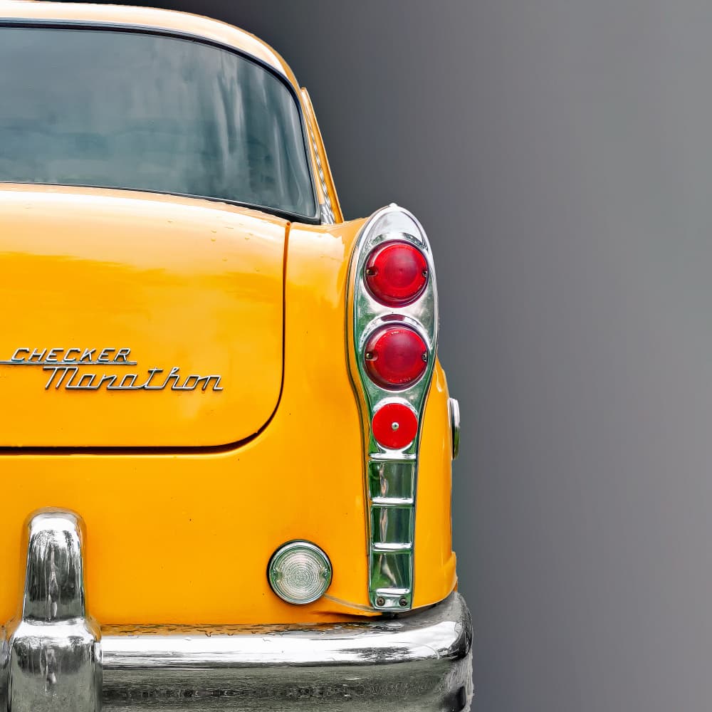 Vintage Yellow Car Rear by Roland Weber — canvas wall art