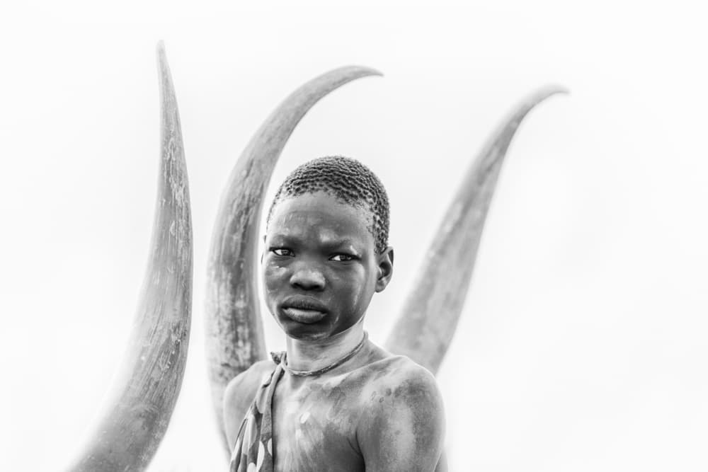 African Child and Tusks by Trevor Cole — canvas wall art