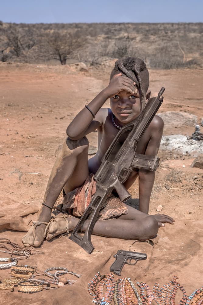 African Child With Rifle by Marcel Egger — canvas wall art