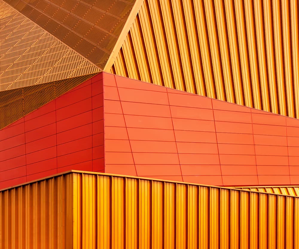 Orange Geometric Building by Theo Luycx — canvas wall art
