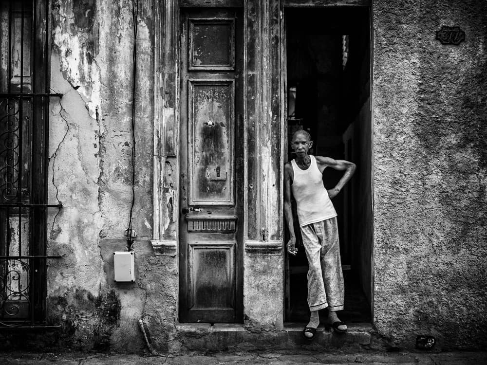 Elderly Woman Doorway by Pavol Stranak — canvas wall art