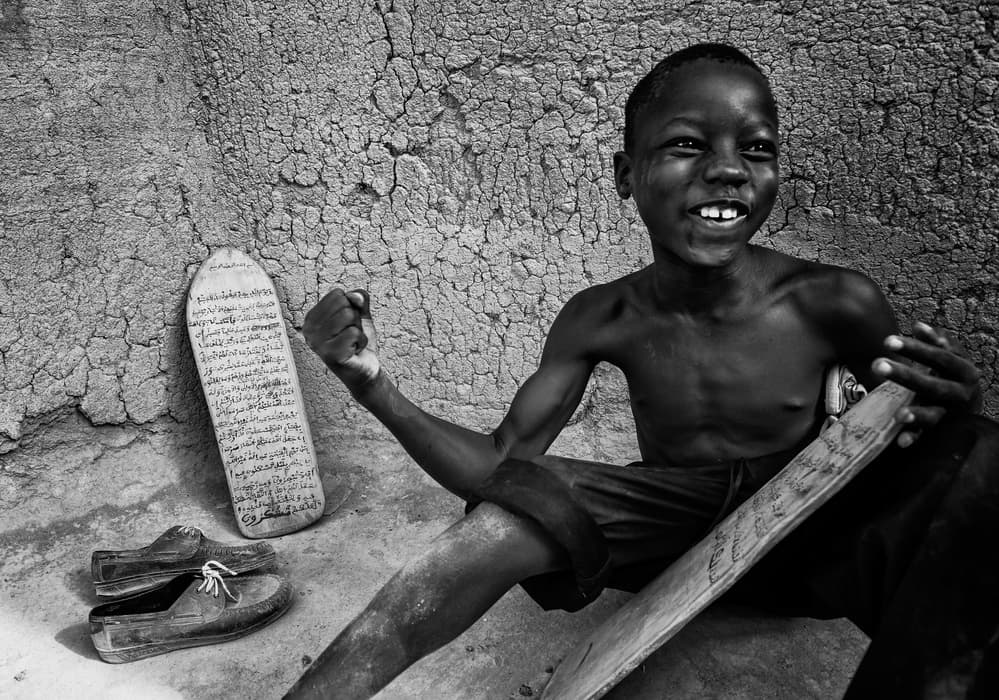 Smiling African Student by Joxe Inazio Kuesta Garmendia — canvas wall art