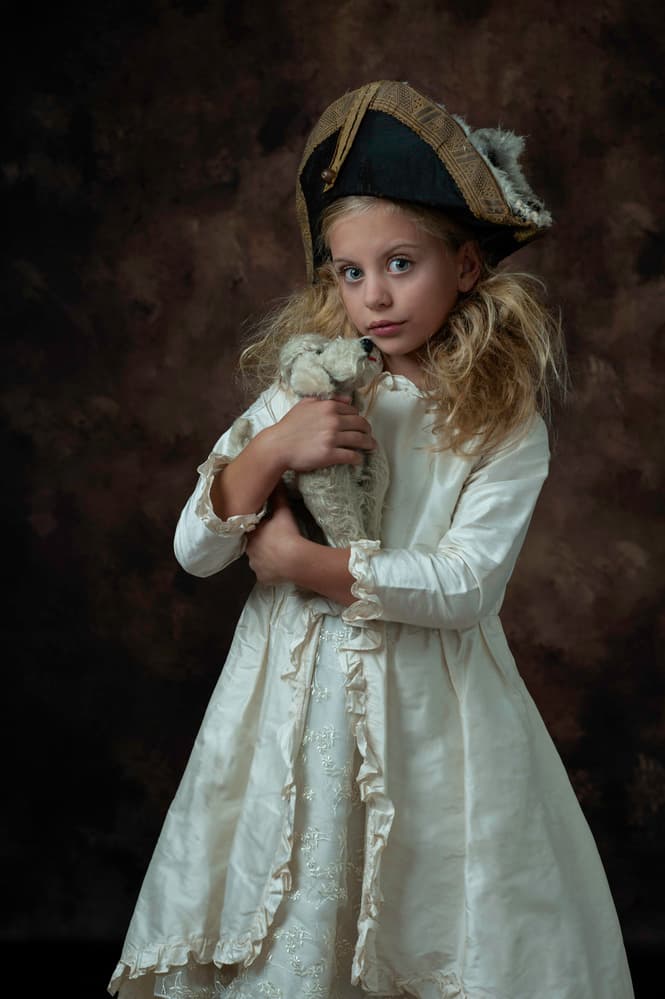 Pensive Girl With Toy by Monika Vanhercke — canvas wall art