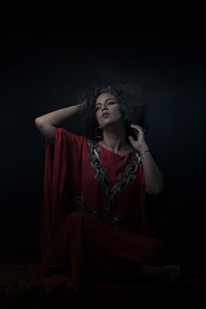 Dramatic Red Kaftan Portrait by Moein Hasheminasab — canvas wall art