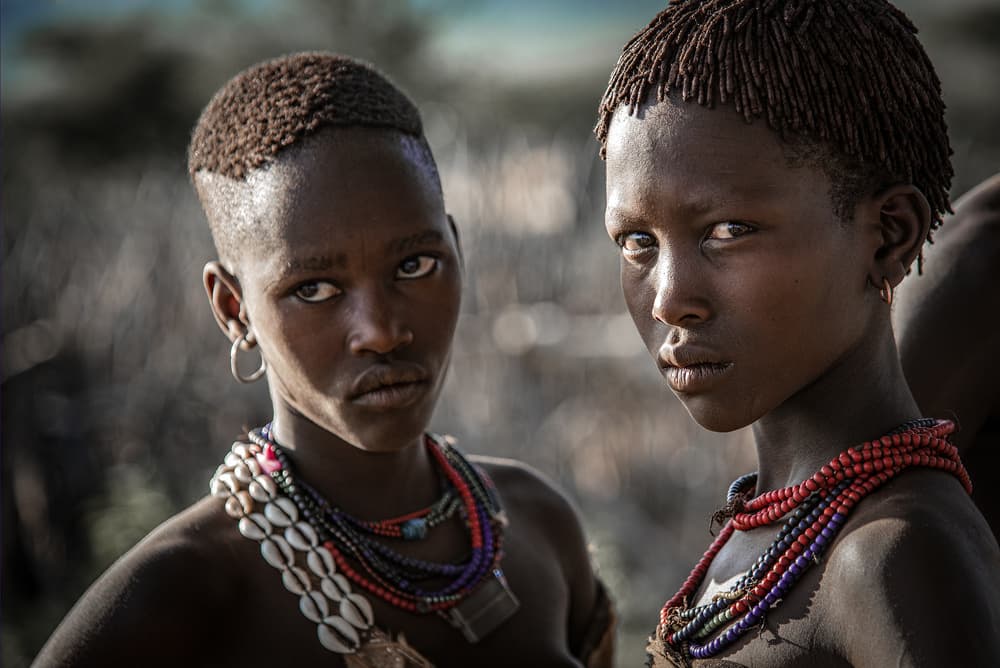 Young Tribal Faces by Linda Wride — canvas wall art
