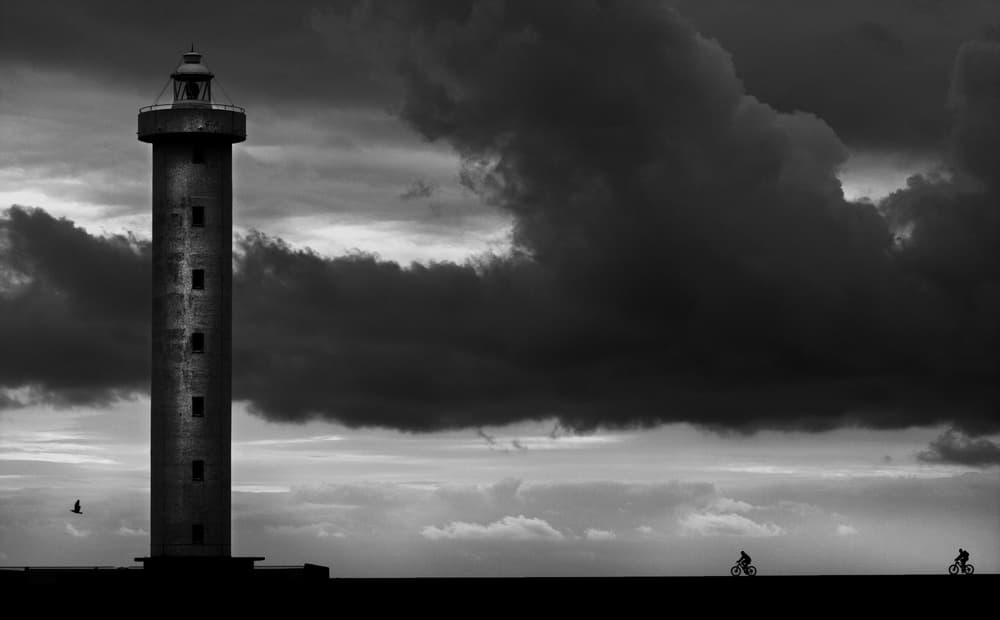 Dramatic Lighthouse Silhouette by Luciano Caturegli — canvas wall art