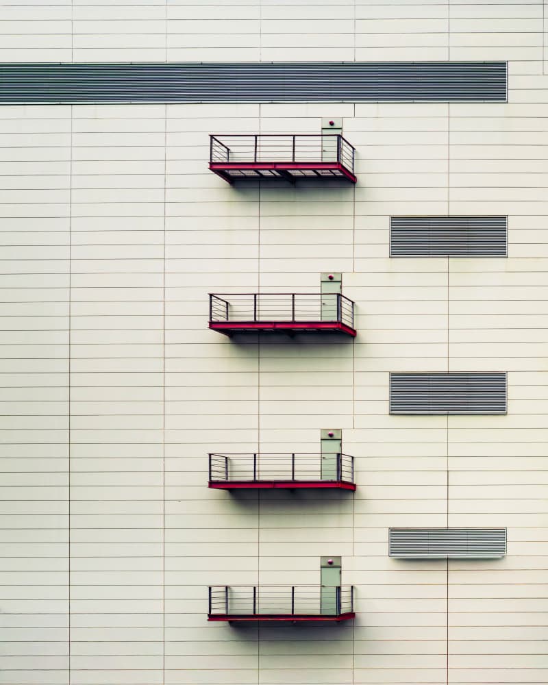 Stacked Red Balconies by Leah Guo — canvas wall art