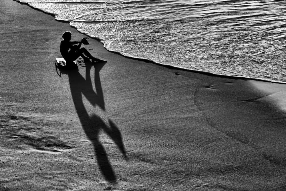 Lone Silhouette Beach Waves by Jois Domont ( J.L.G.) — canvas wall art
