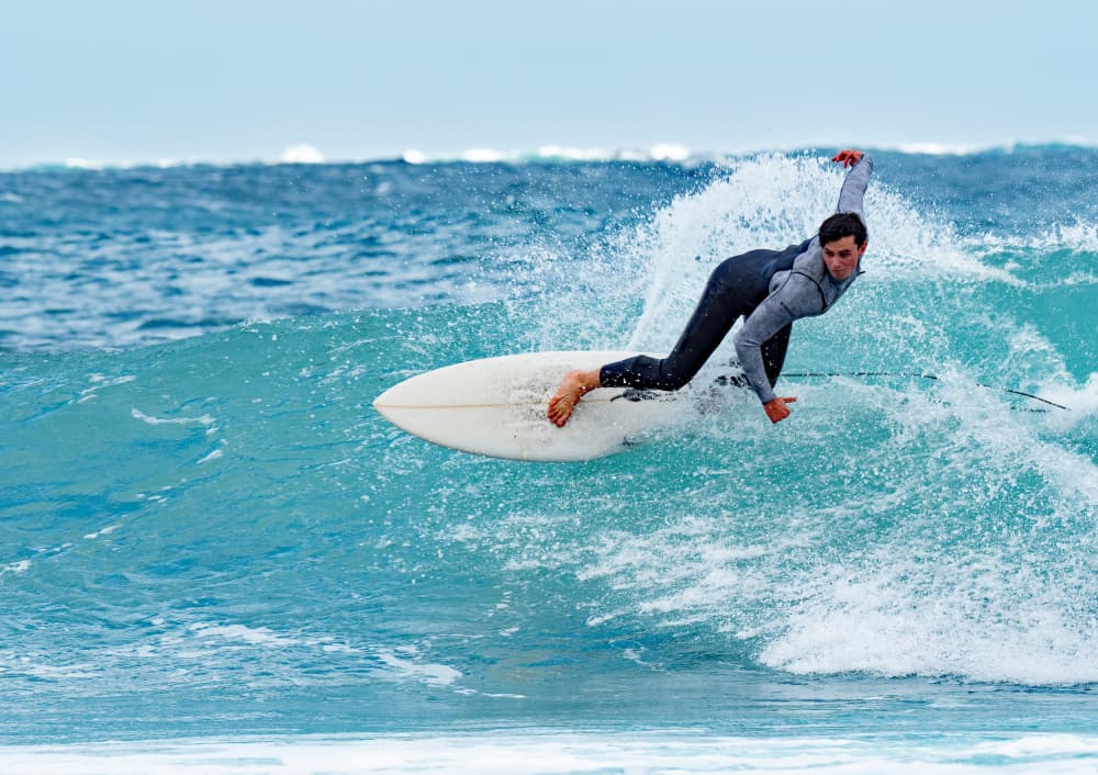 Surfer On Wave by Dirk Lombard — canvas wall art