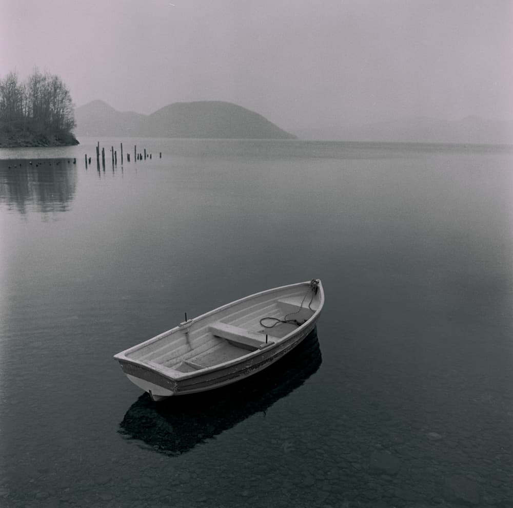 Misty Lake Rowboat by Fuyuki Hattori — canvas wall art