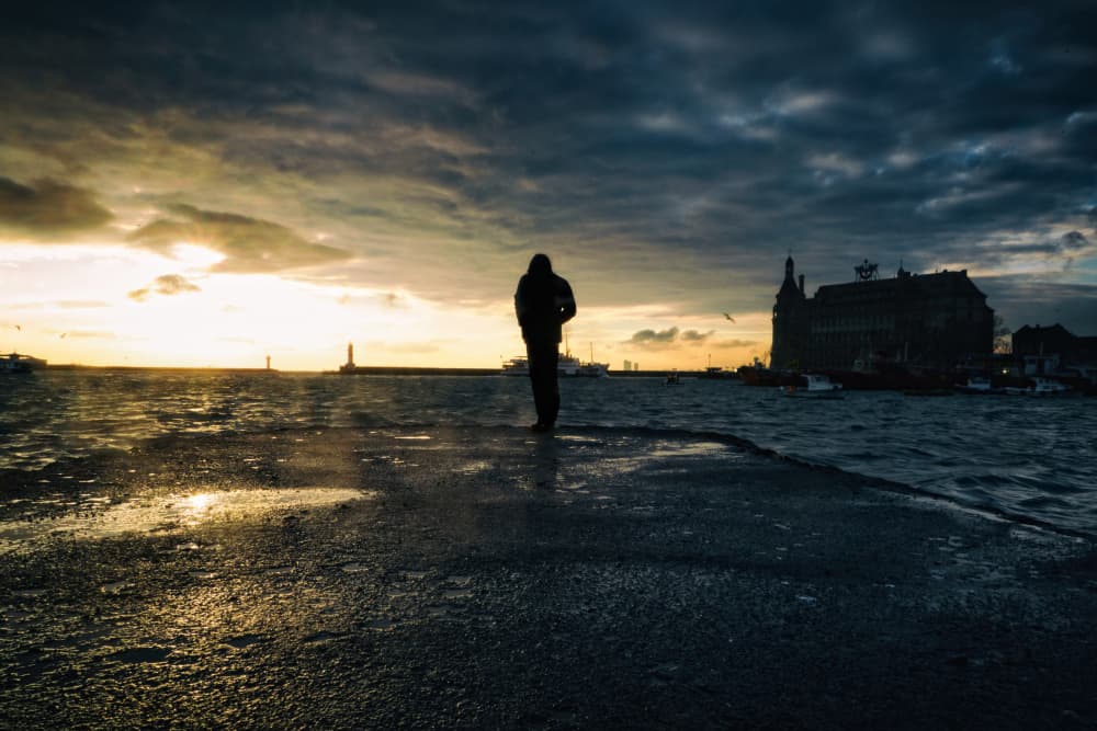 Man on the Pier by Merthan Kortan — canvas wall art