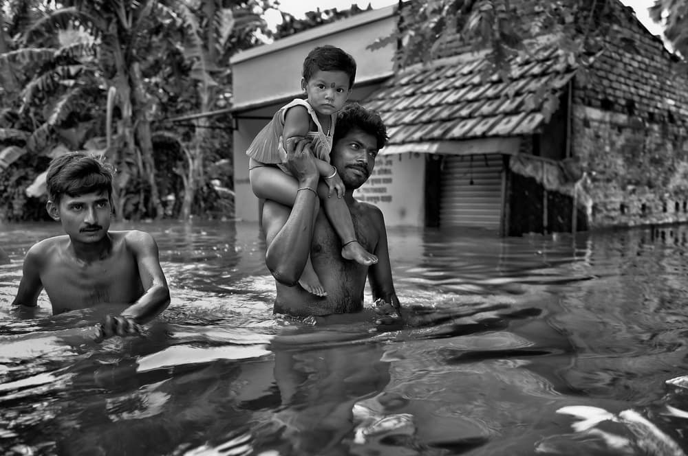 Family During Monsoon Flood by Avishek Das — canvas wall art