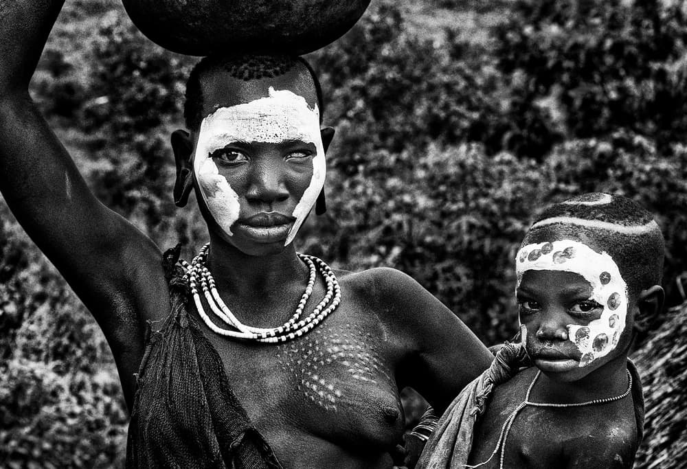 Surma tribe woman and her child - Ethiopia by Joxe Inazio Kuesta Garmendia — canvas wall art