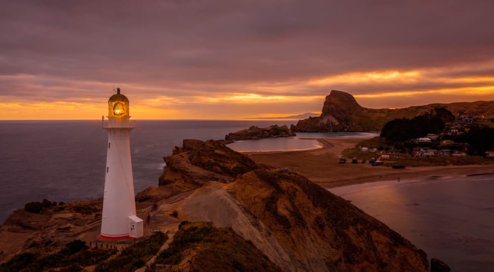 Dramatic Lighthouse Sunset by Raimondo Restelli — canvas wall art