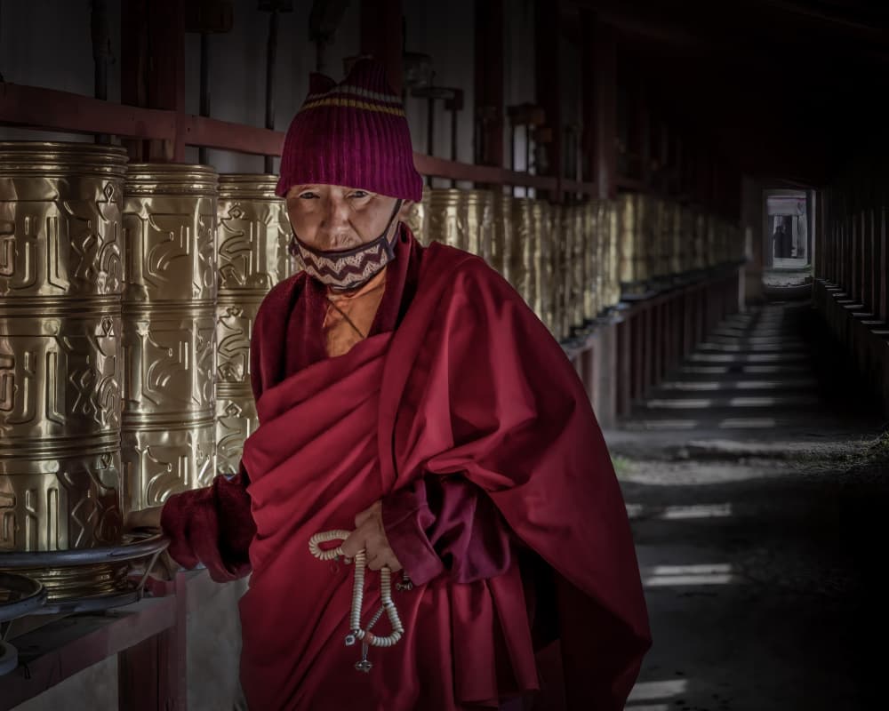 Monk with Prayer Wheels by Irene Wu — canvas wall art