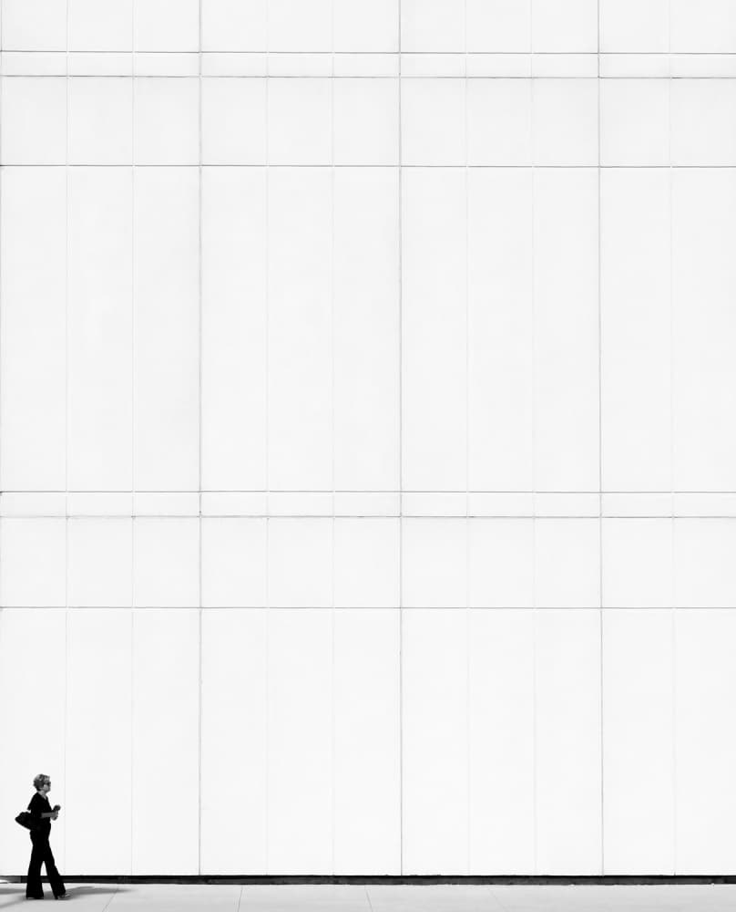 Silhouette Against White Wall by Jian Wang — canvas wall art