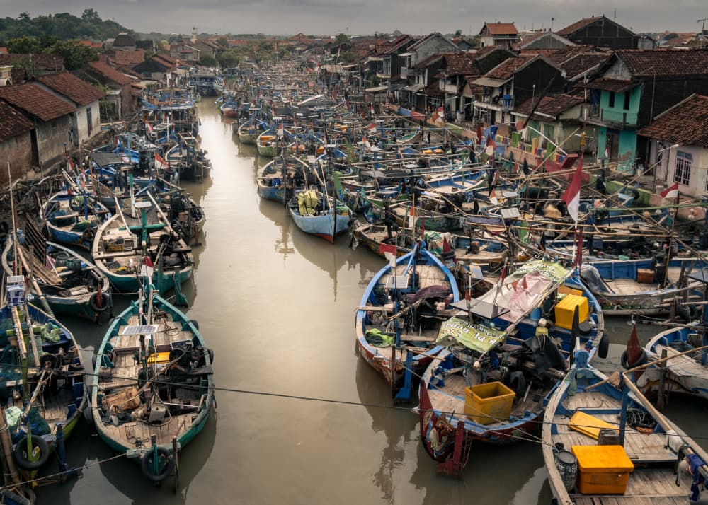 Crowded Fishing Village Canal by Alin Federiga — canvas wall art