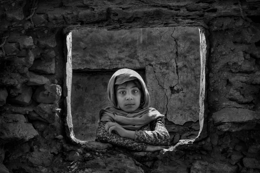 Child In Stone Window by Saeed Dhahi — canvas wall art
