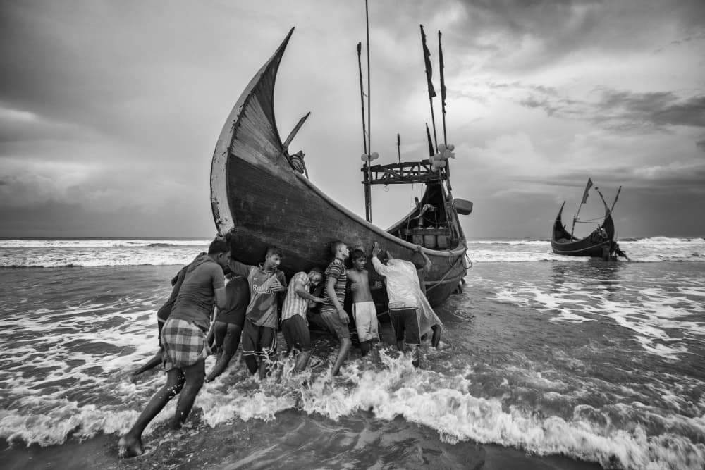 Fishermen Launching Boat by Azim Khan Ronnie — canvas wall art