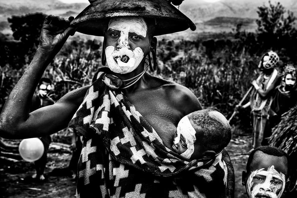 Indigenous Face Paint Family by Joxe Inazio Kuesta Garmendia — canvas wall art