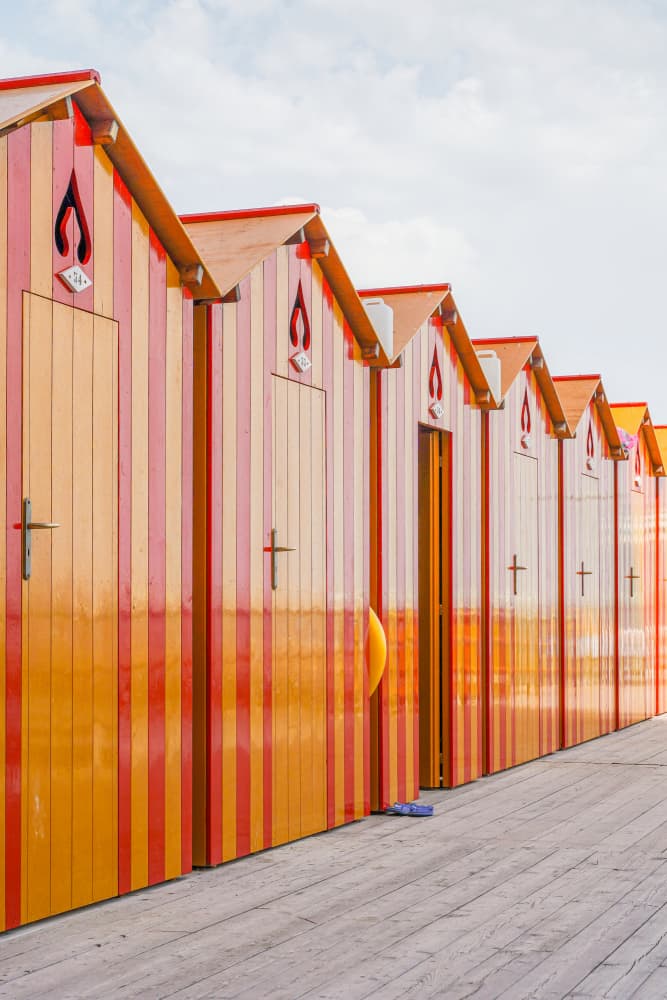 Colorful Beach Huts by Henrike Schenk — canvas wall art