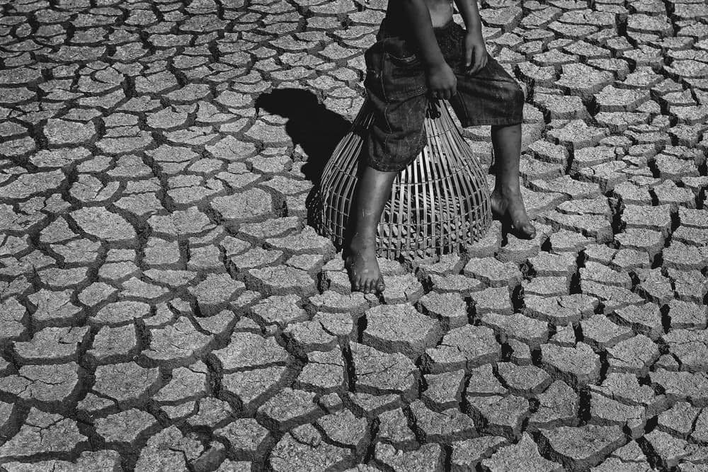 Child and Dry Earth by ADIREK M — canvas wall art
