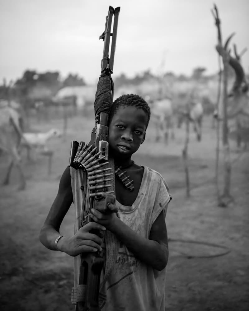 African Boy With Rifle by Max Vere-Hodge — canvas wall art