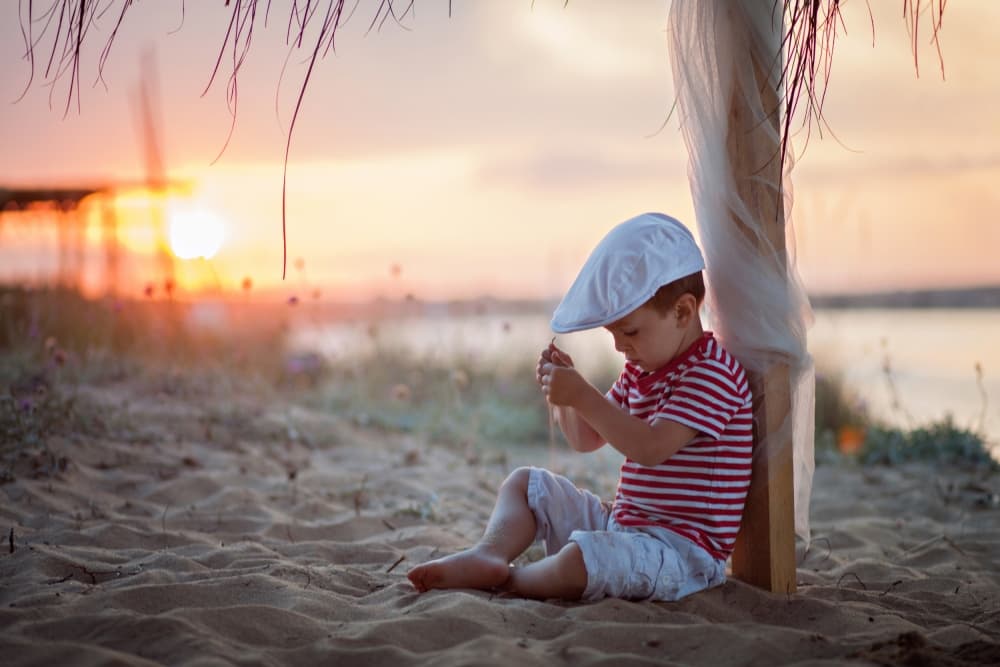 Boy On Sunset Beach by Tatyana Tomsickova — canvas wall art