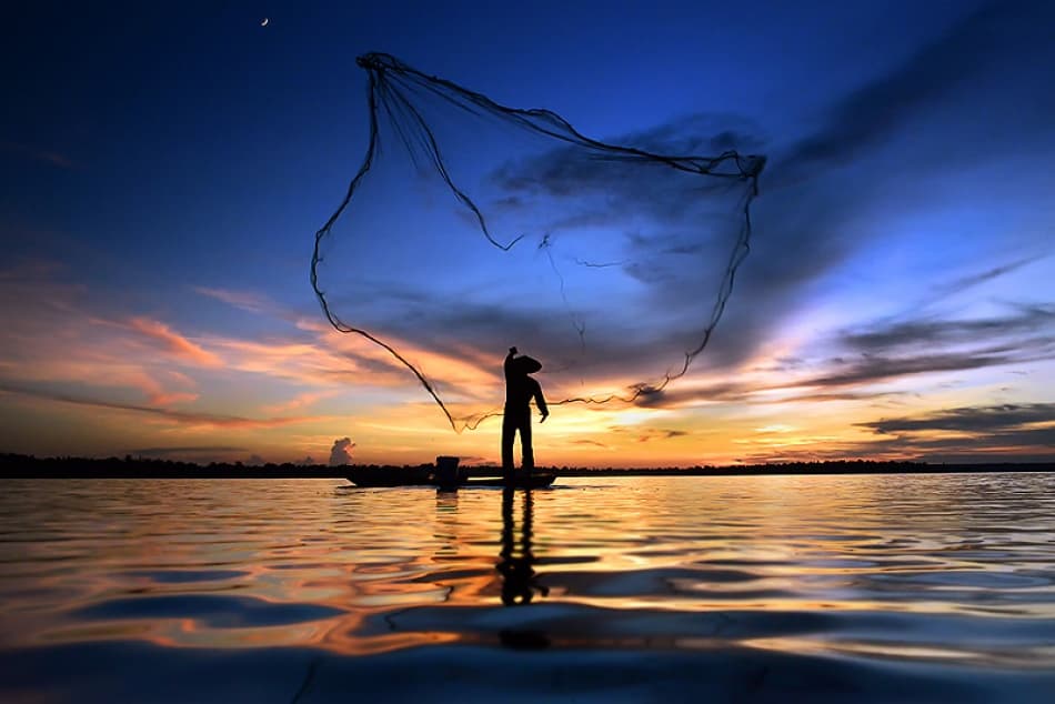 Fisherman Casting Net Sunset by Sarawut Intarob — canvas wall art