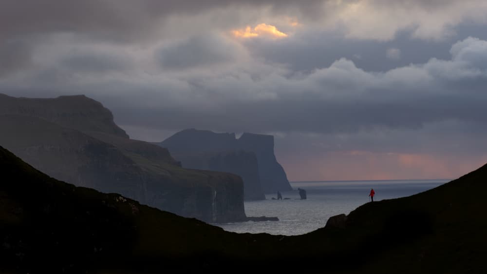 Lone Hiker Wild Coast by April Xie — canvas wall art