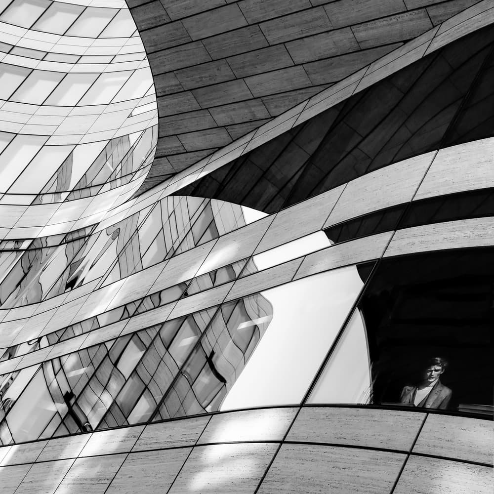 Man in Reflective Architecture by Luc Vangindertael (laGrange) — canvas wall art