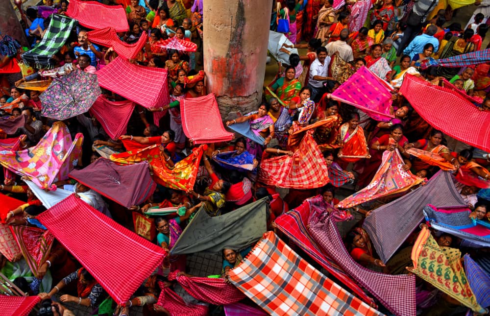 Vibrant Fabric Gathering by Avishek Das — canvas wall art