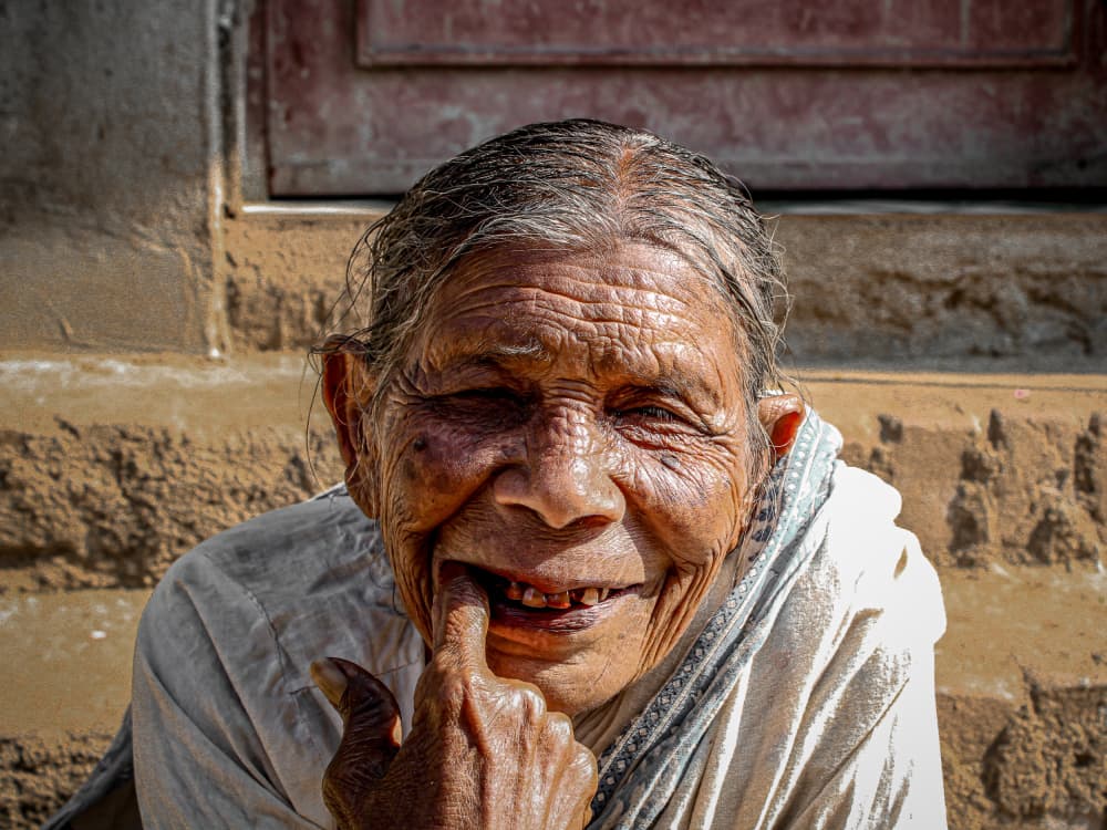 Smiling Elder Portrait by Subhajit Das — canvas wall art