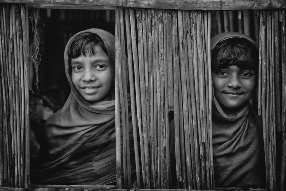 Curious Girls Peeking by Avishek Das — canvas wall art