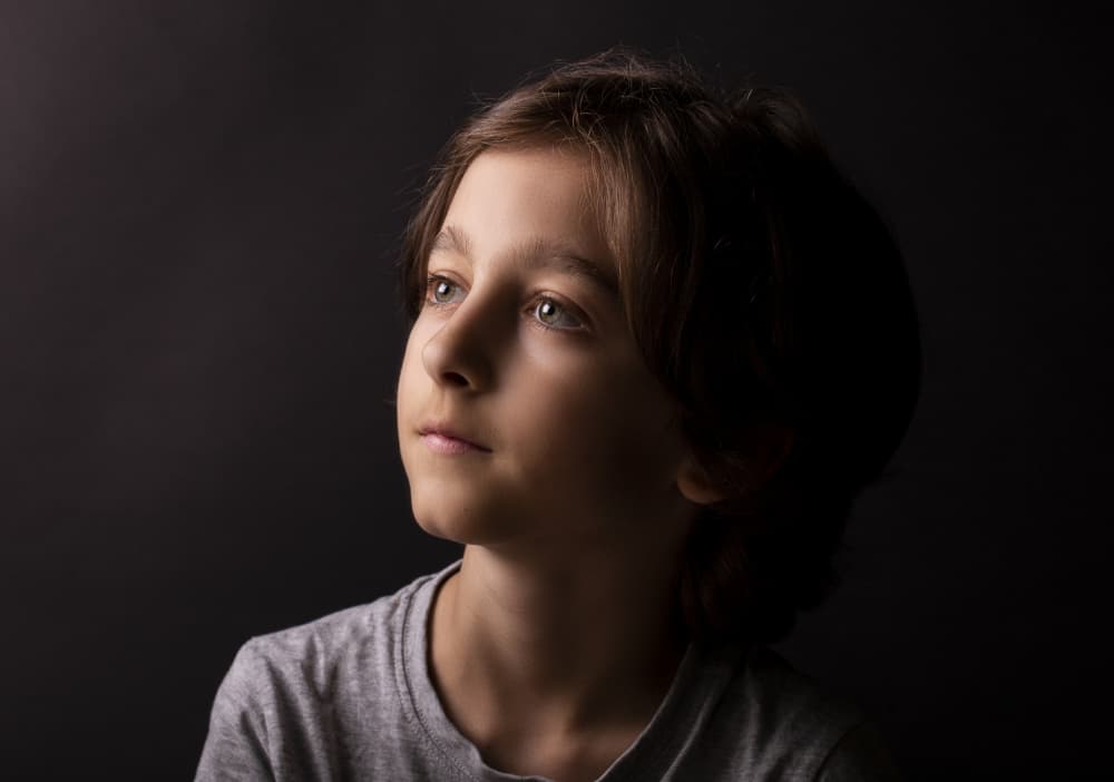 Thoughtful Boy Portrait by Carmen Watkins — canvas wall art